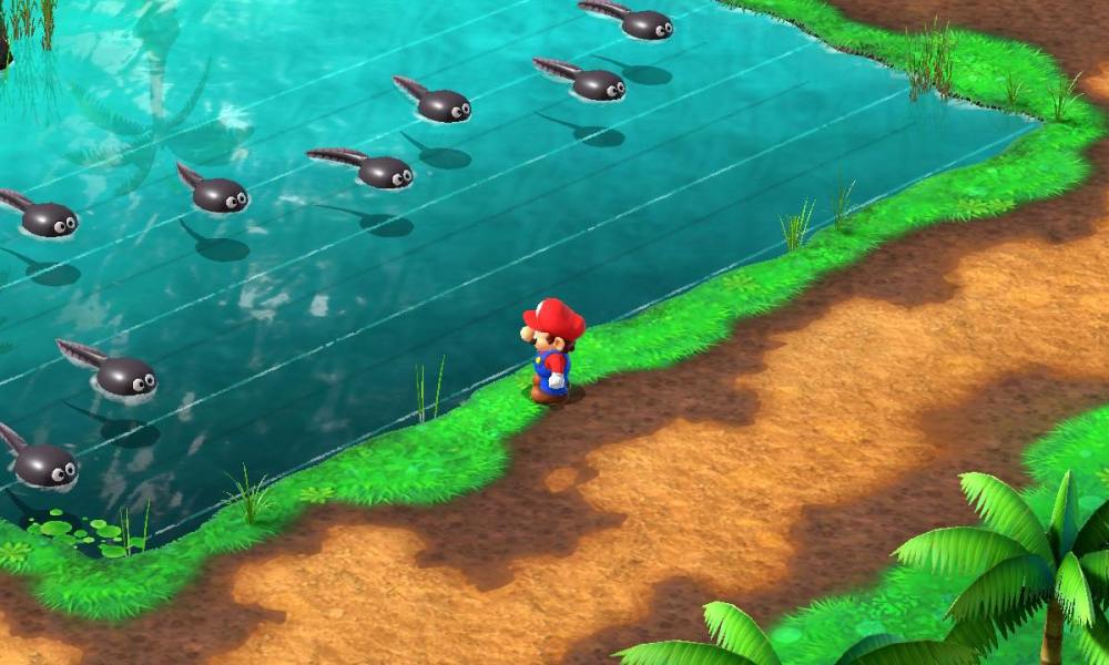 Mario stands near a pond in Super Mario RPG.