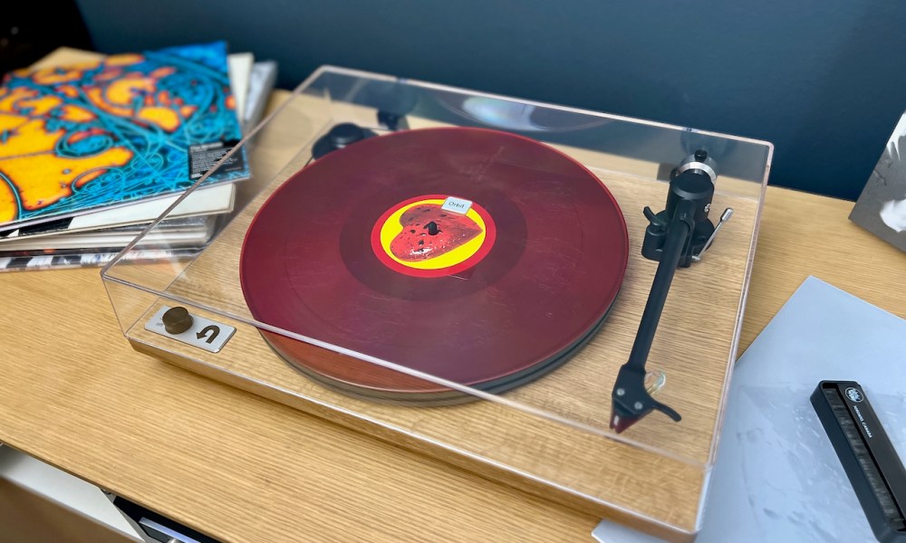 The U-Turn Orbit Special turntable with a red vinyl record on it.