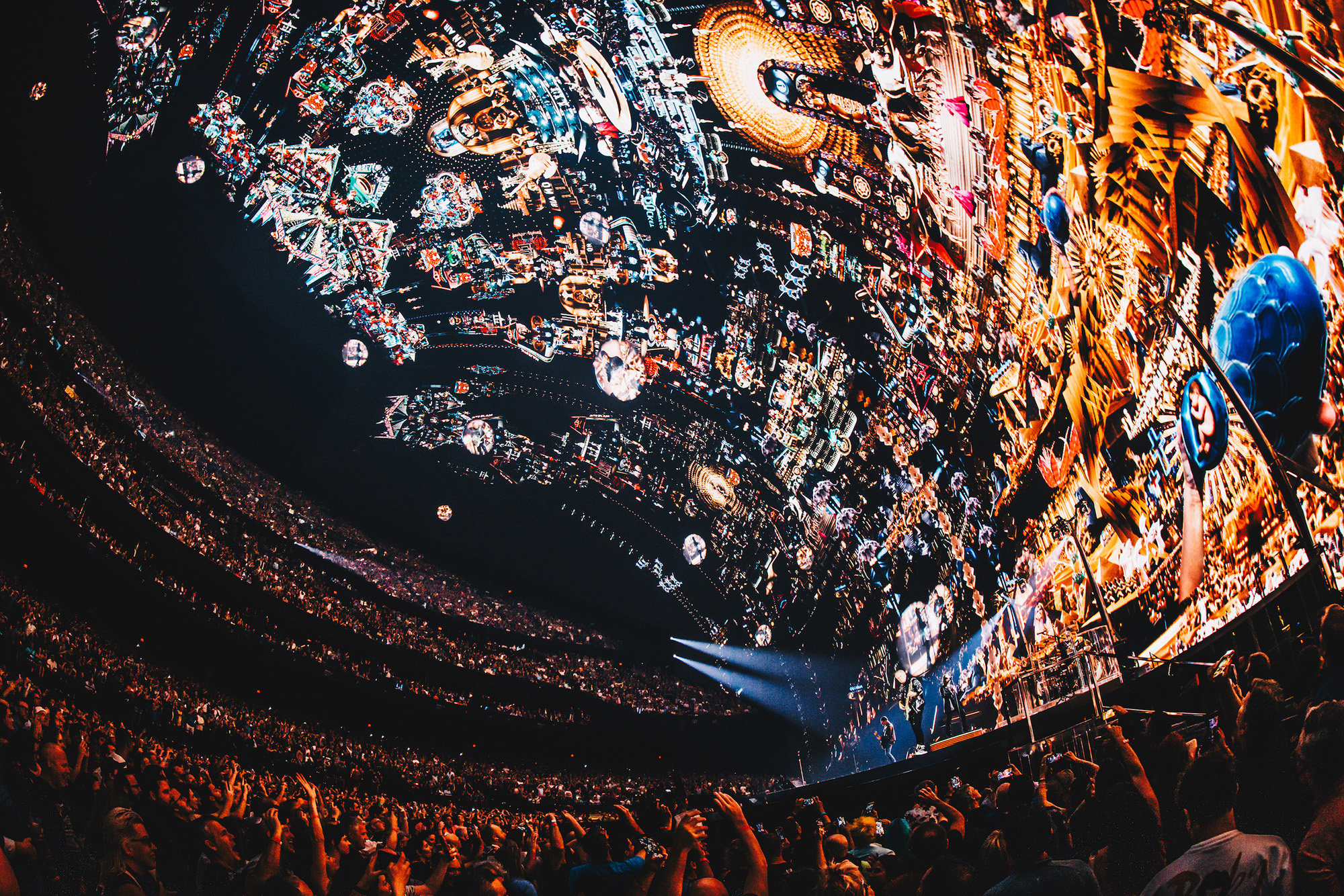 A wide-angle image inside the Sphere in Las Vegas showing how the visualization crawls up the sides and top of the venue.