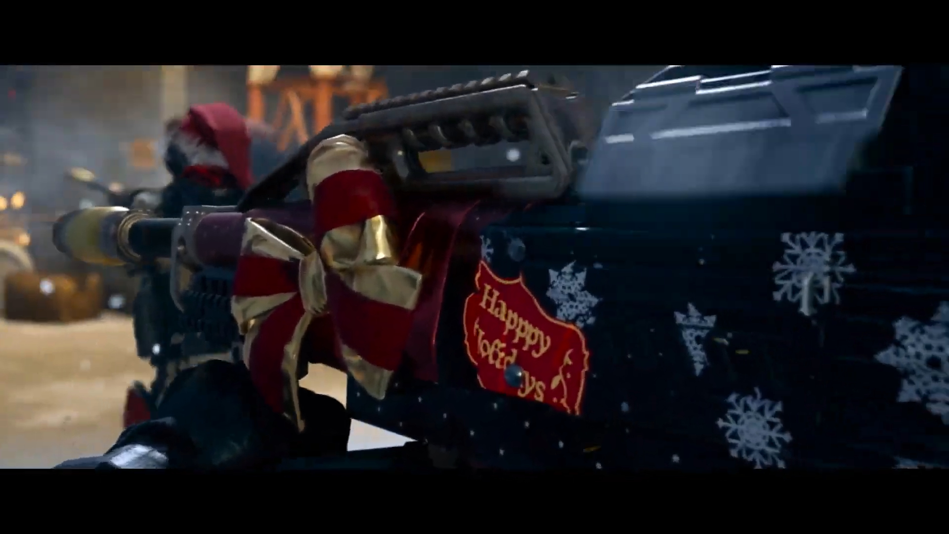 A gun with a ribbon and happy holidays sticker.