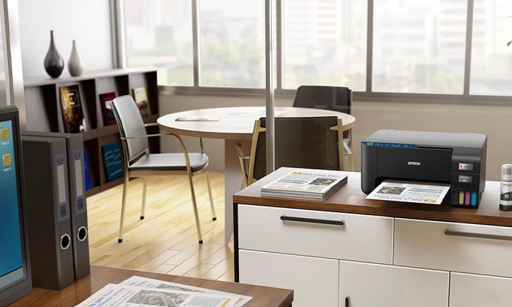 The Epson EcoTank ET-2400 on a desk in an office environment.