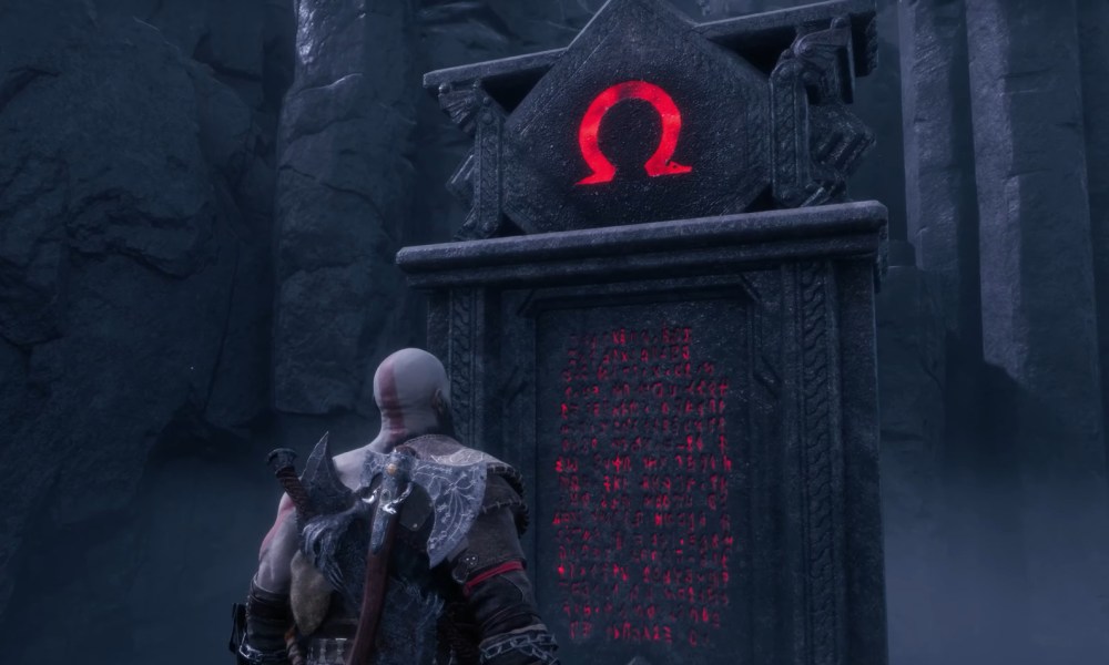 Kratos standing by a stone monolith.