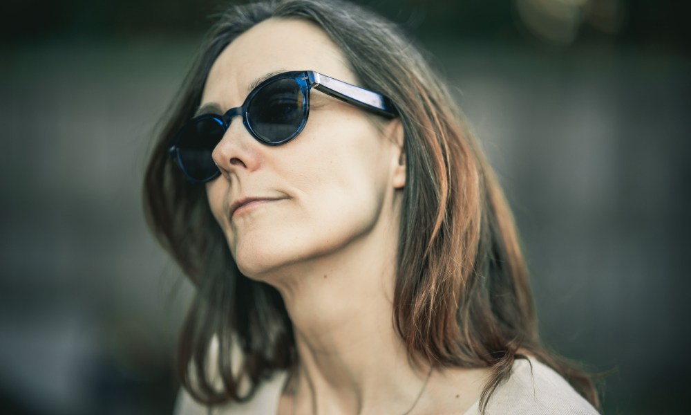 Third-generation Amazon Echo frames in blue seen on a stunning woman.