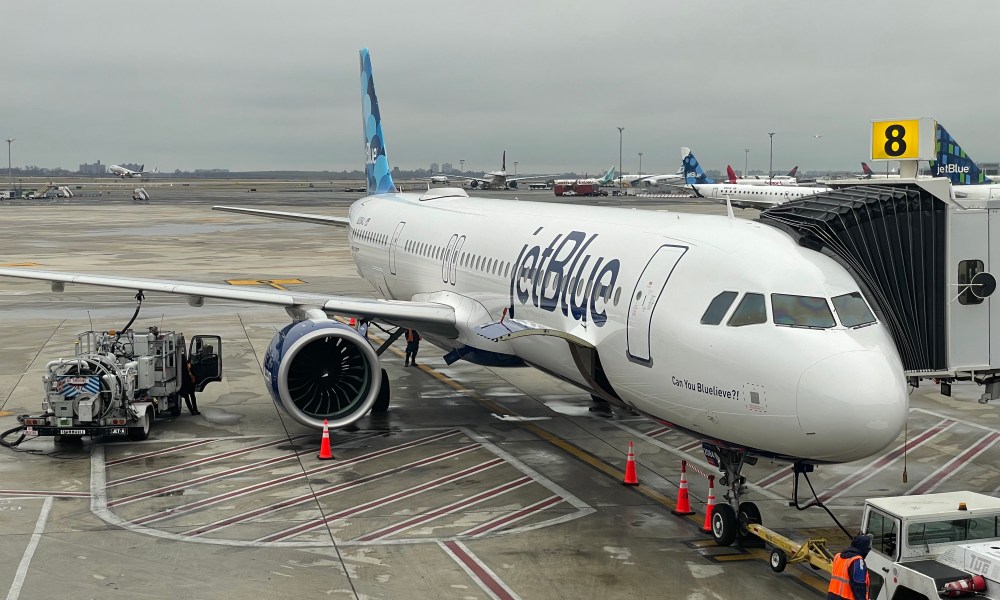 A JetBlue airplane at the airport gate.