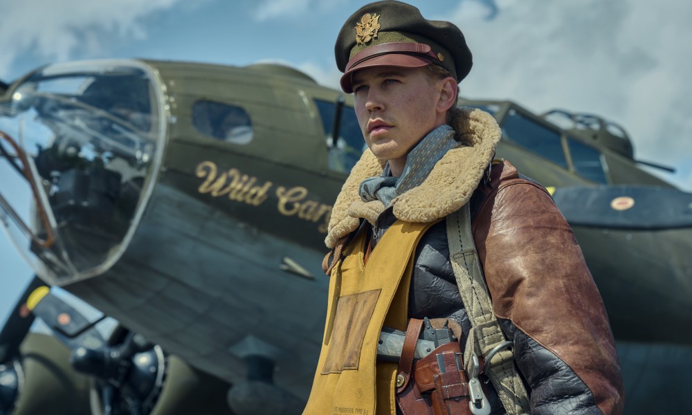 Austin Butler stands near a WWII plane in Masters of the Air.