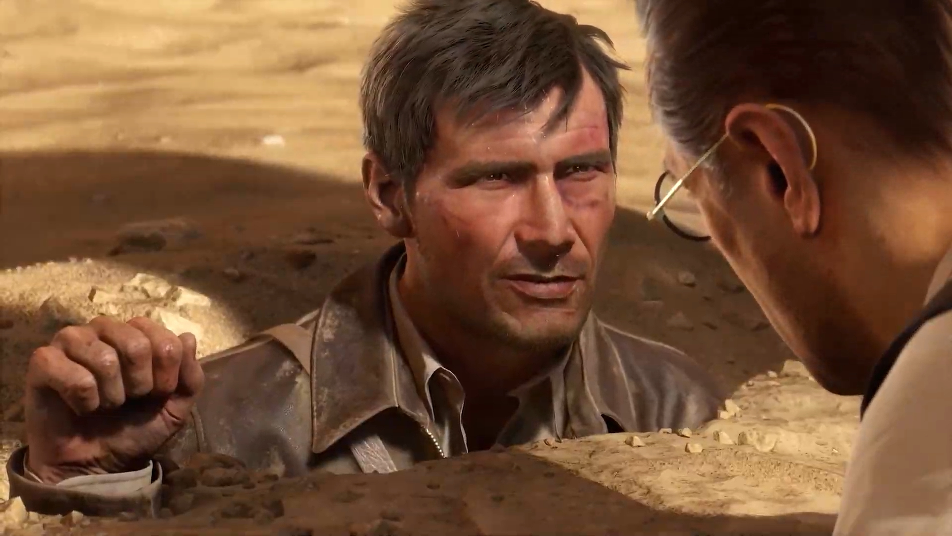 Indiana Jones enterrado en la arena.