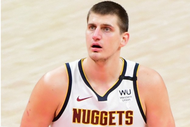 Nikola Jokic squares up a free throw on the court.