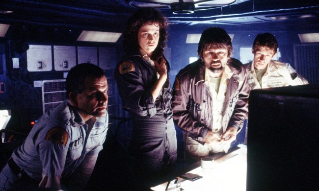 Four people look at a computer in Alien.