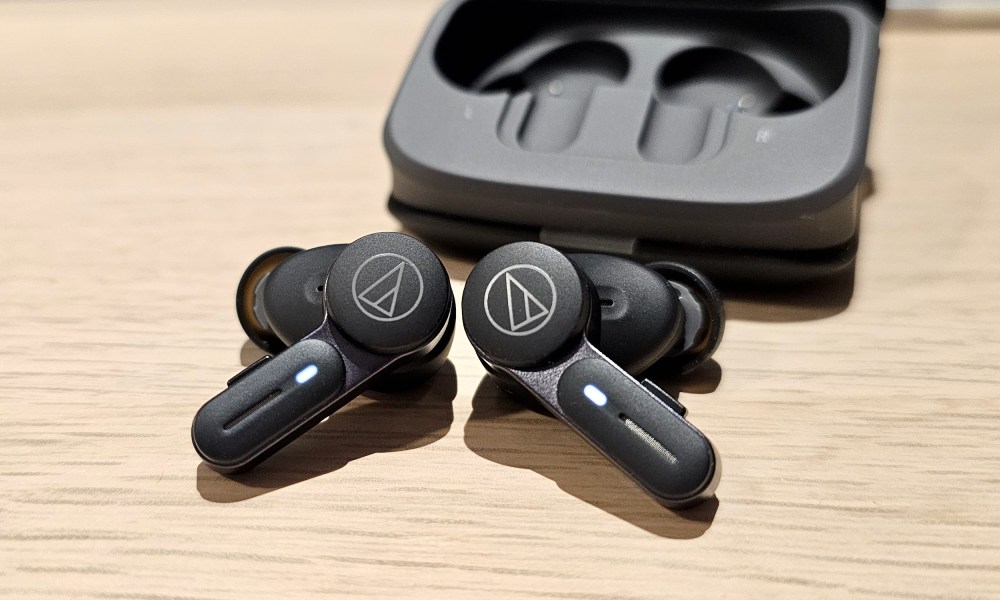 Audio-Technica ATH-TWX7, both earbuds in front of case.