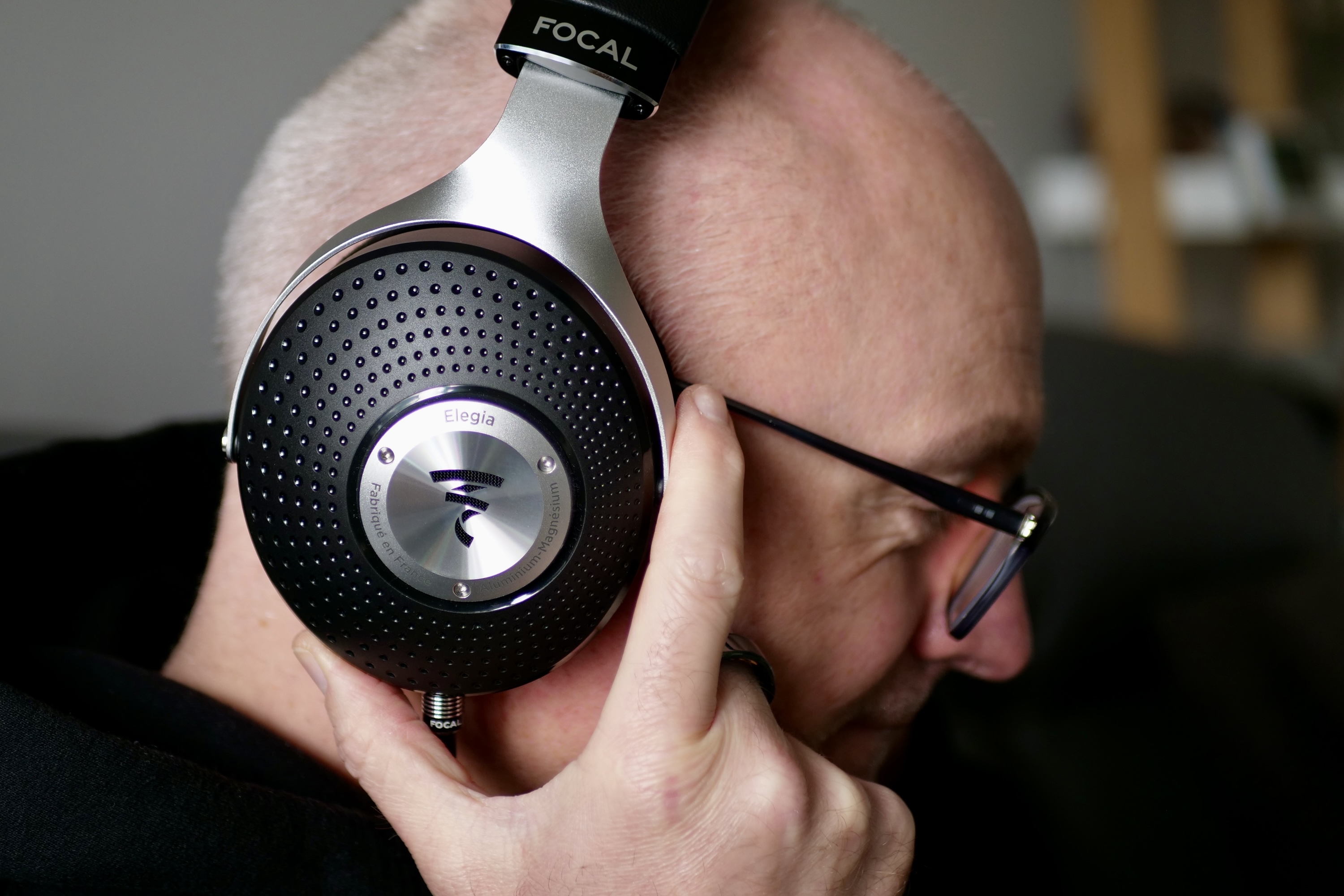 A person wearing the Focal Elegia headphones