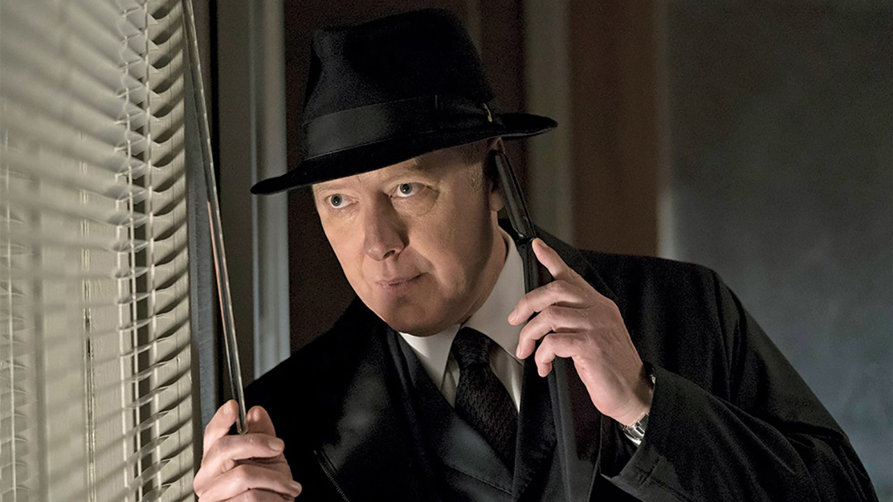 Raymond Reddington from The Blacklist on the phone, peaking out a window.