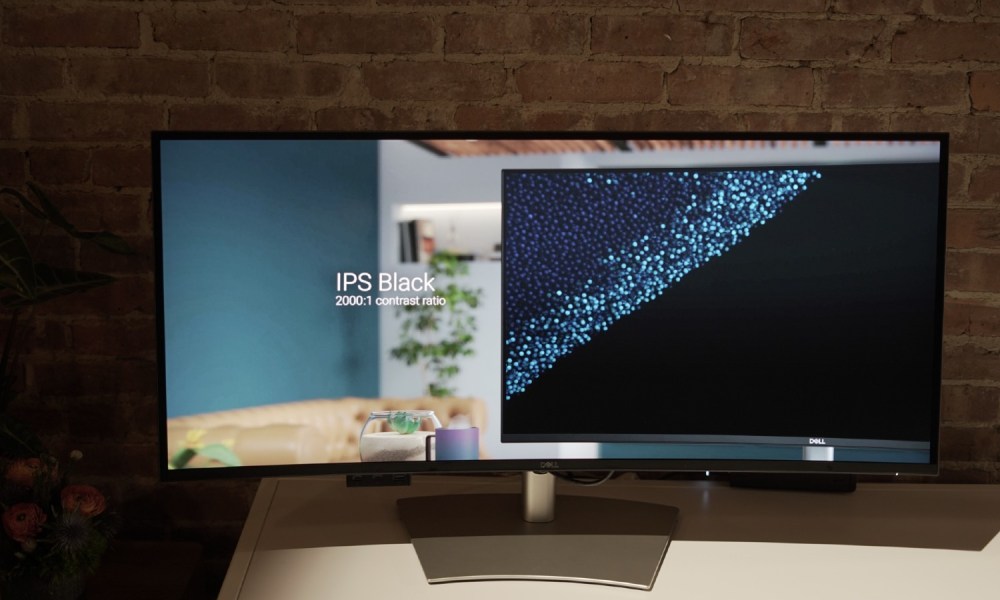 A Dell UltraSharp 5K monitor showing a graphic about IPS Black.