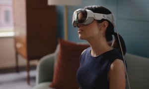 A person tilts their head while wearing the Apple Vision Pro.