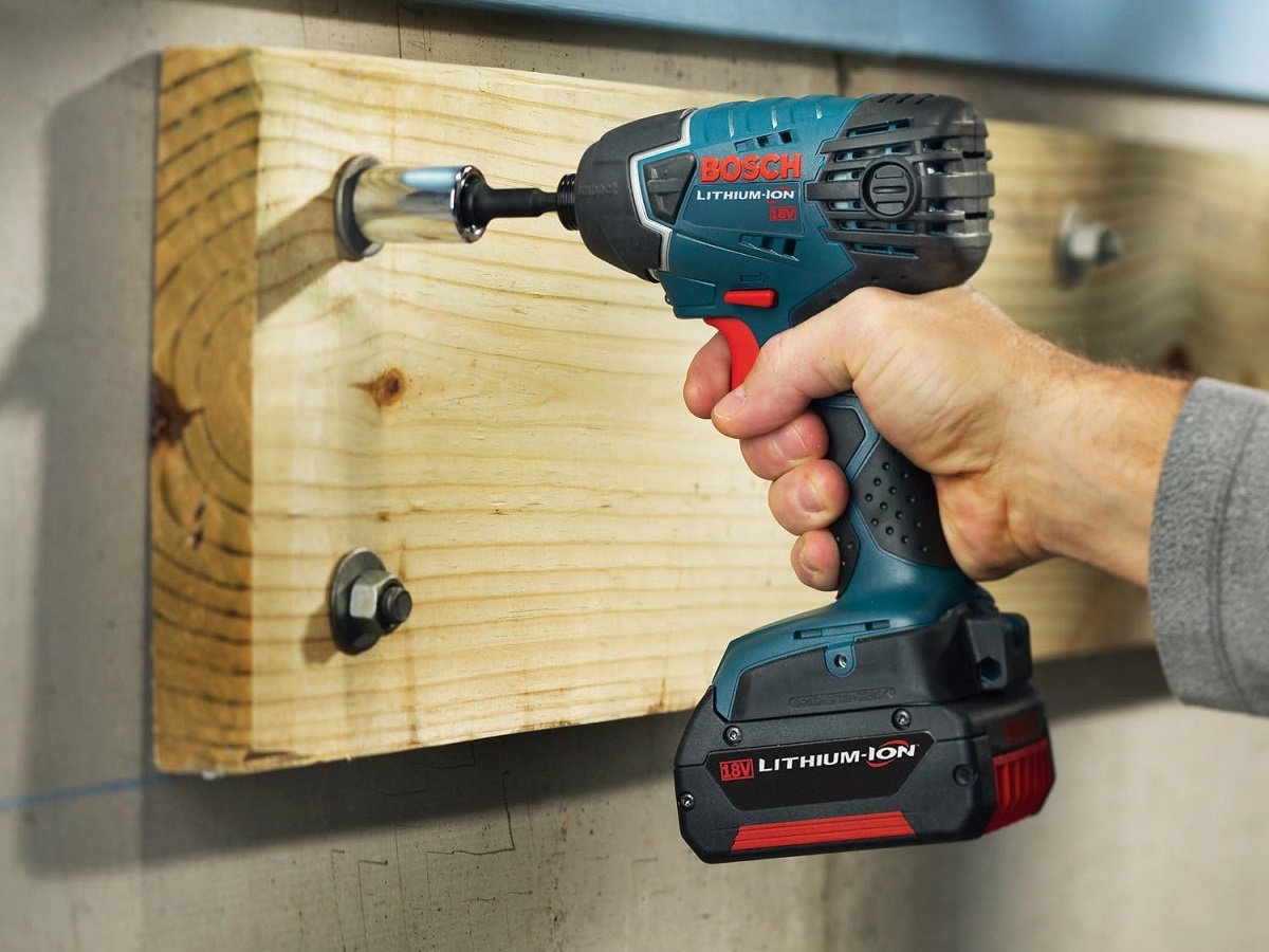 A person using the Bosch 18V Hex Impact Driver.