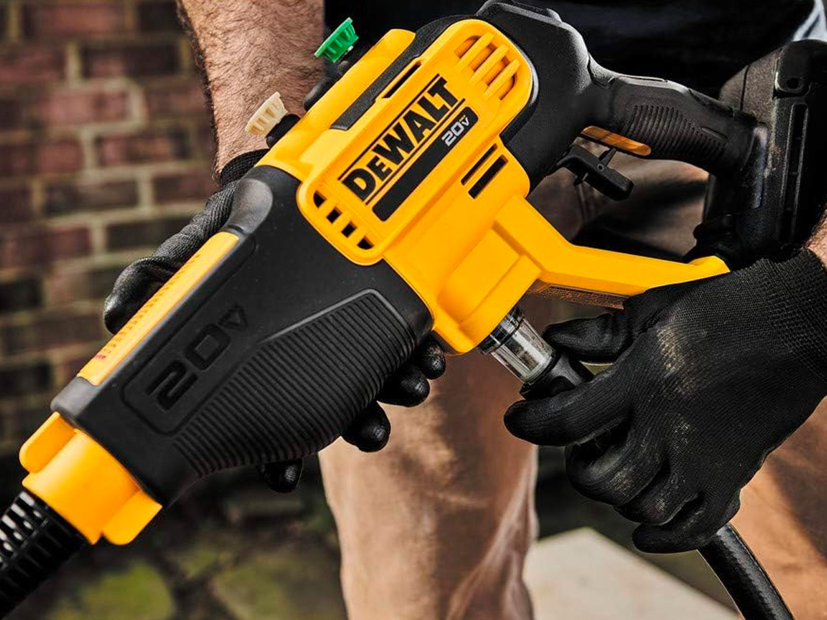 Connecting a hose to the DeWalt cordless pressure washer.