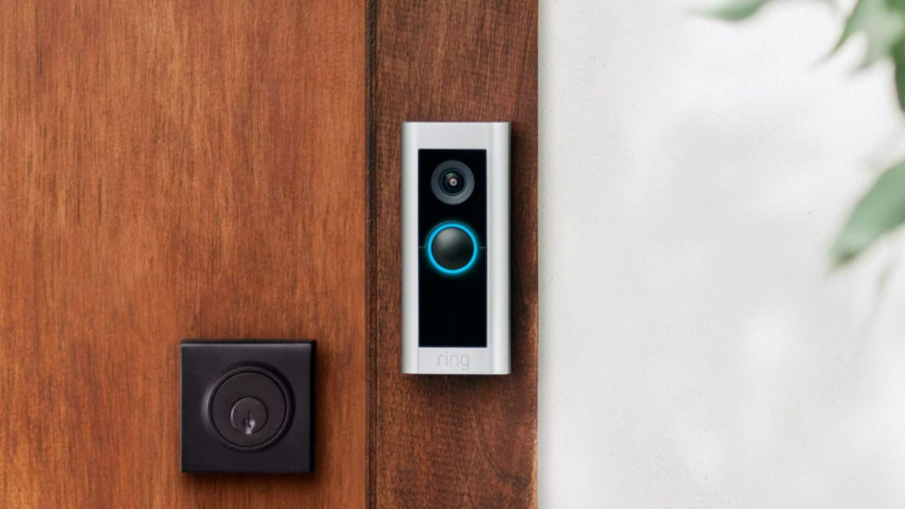 The Ring Pro 2 installed by a wooden door.