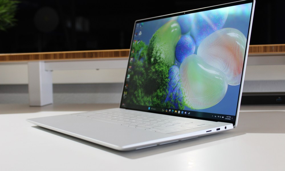 The Dell XPS 14 on a white table with the screen open.