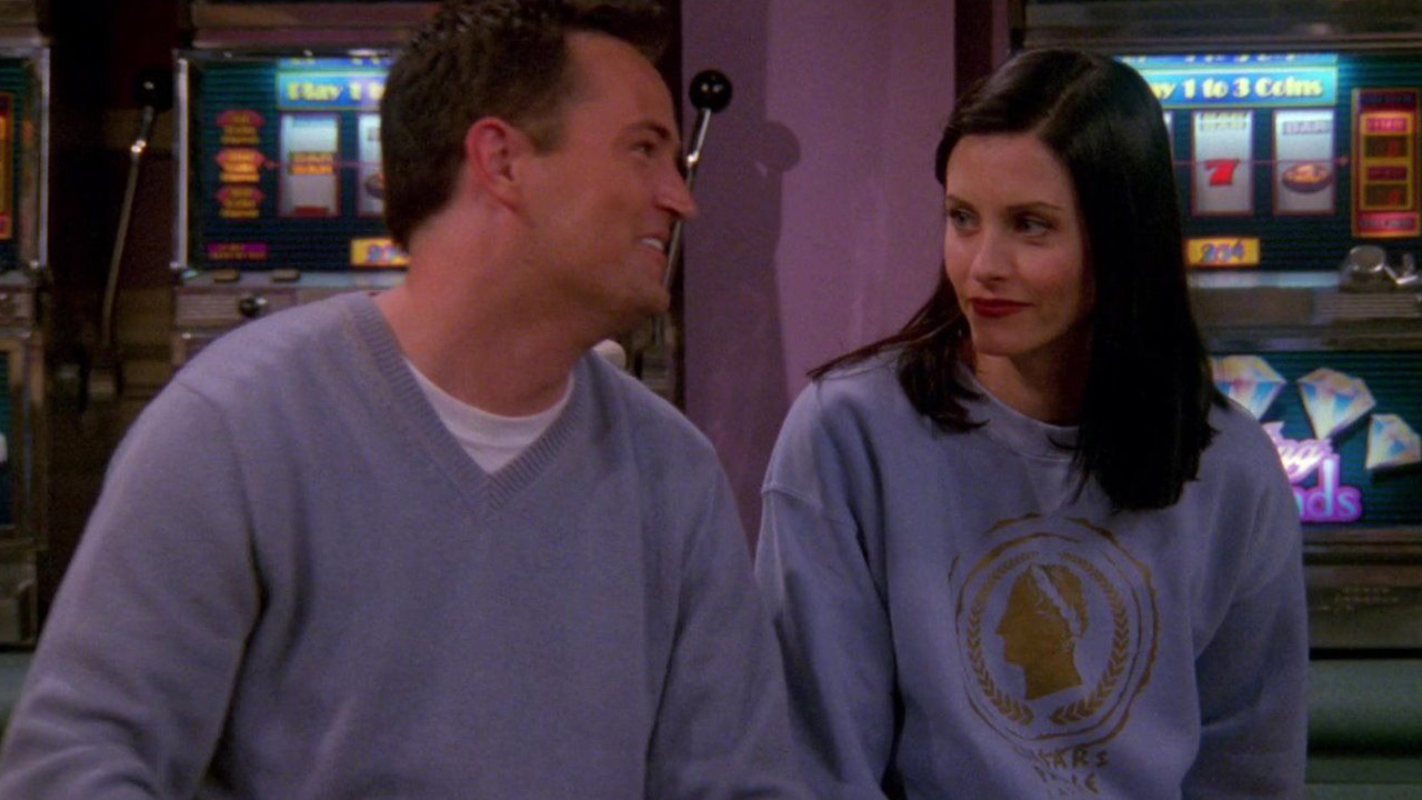 Chandler and Monica looking lovingly at one another in a scene from Friends.