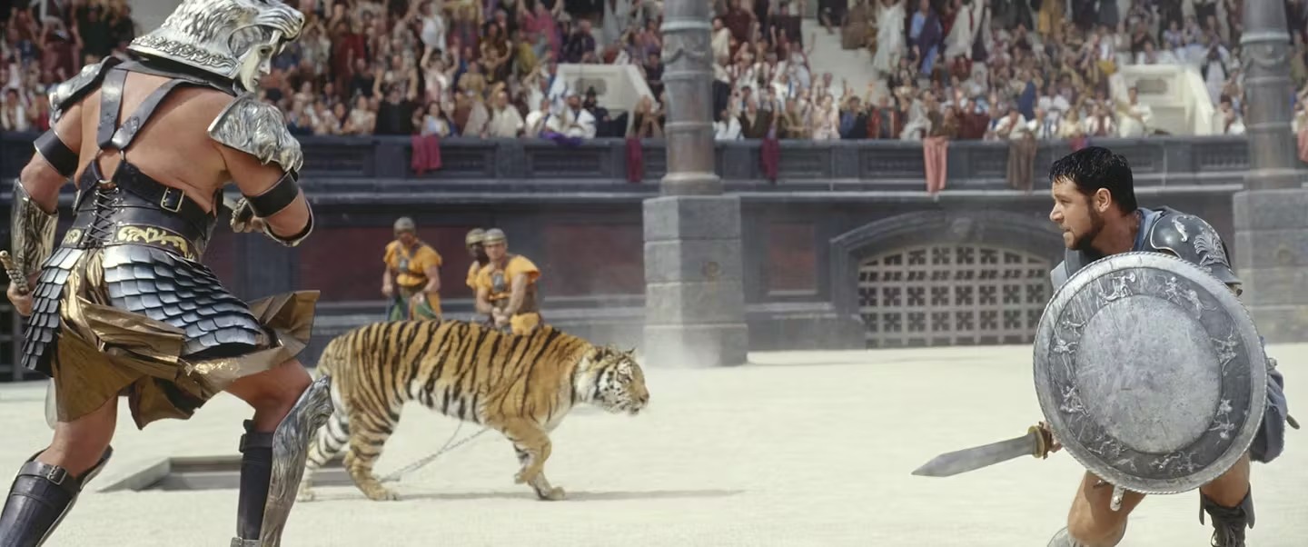 A man fights a soldier and a tiger in Gladiator.