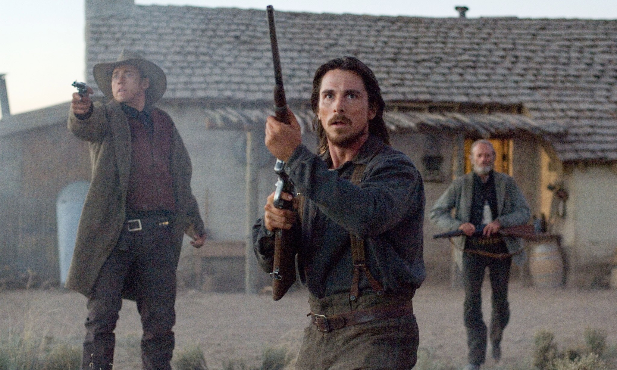 Three men hold guns in 3:10 to Yuma.