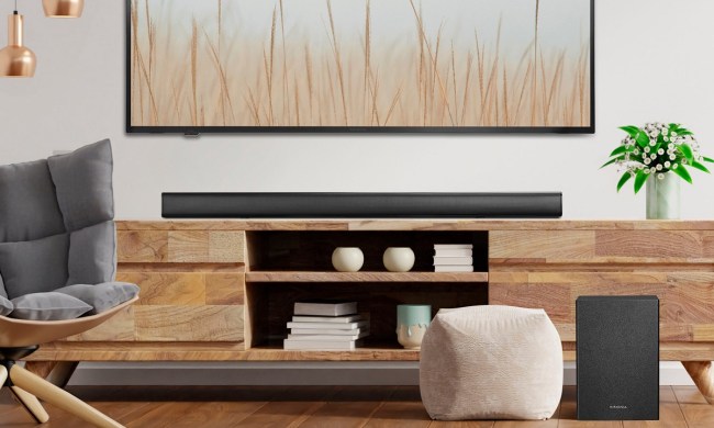 The Insignia 2.1-channel soundbar with wireless subwoofer in a living room.