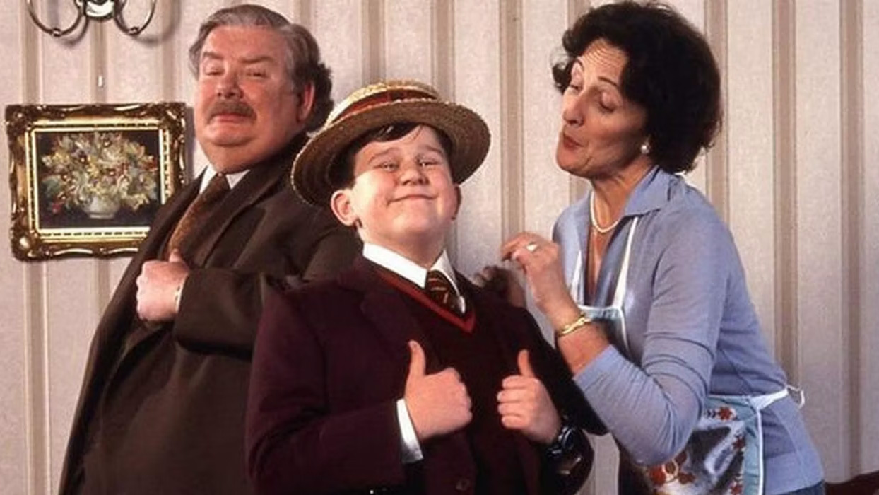 Les Dursley posent pour un portrait de famille.