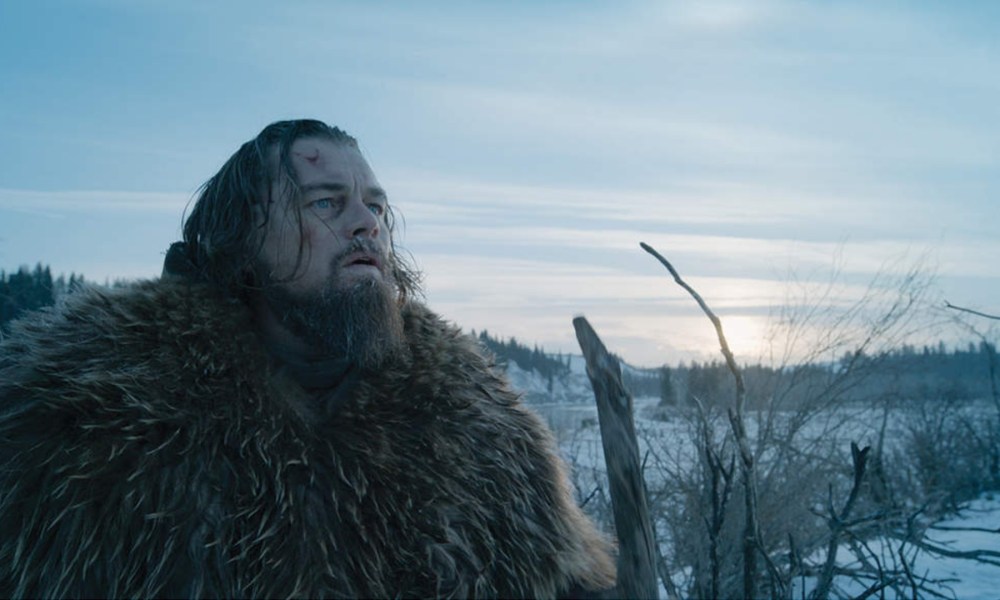 A battered Hugh Glass (DiCaprio) as he navigates the snowy wilderness.