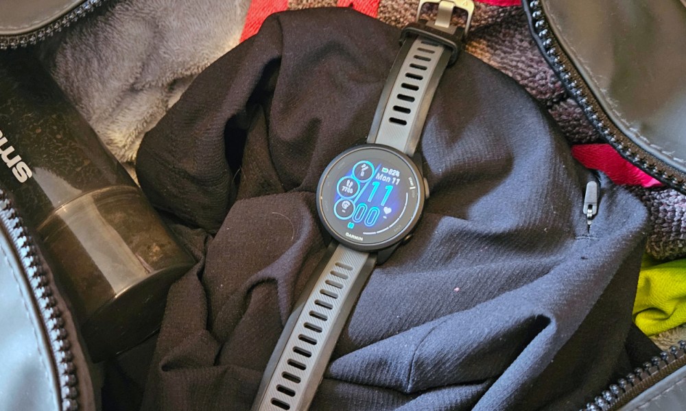 The Garmin Forerunner 165 Music sat in an open gym bag.