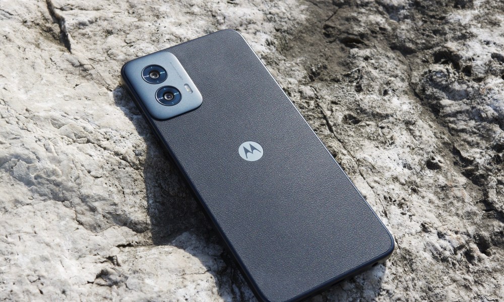 The Moto G Power 5G (2024) lying on a rock outside.