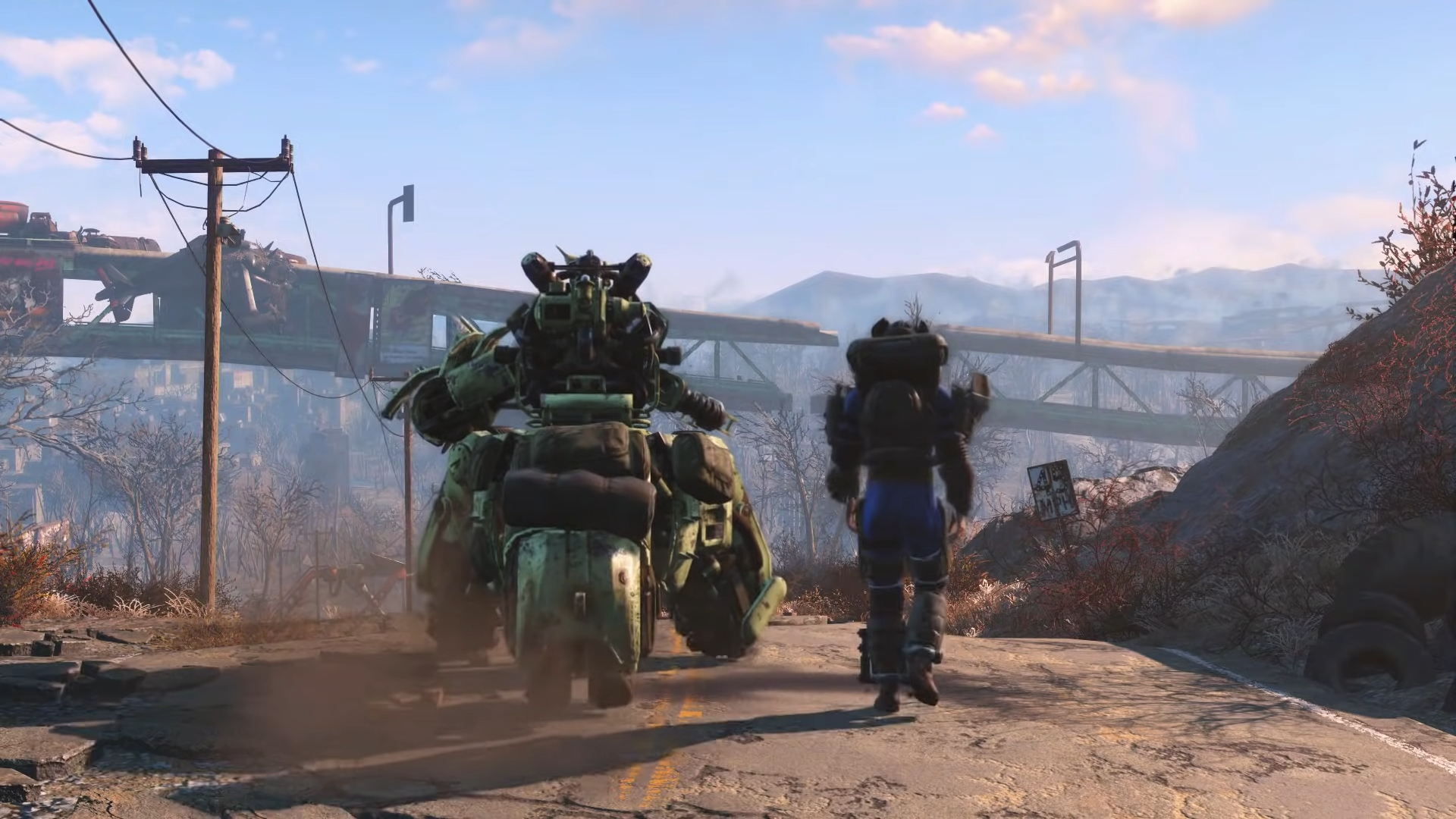 A man and a robot walking in the wastelands in Fallout 4.