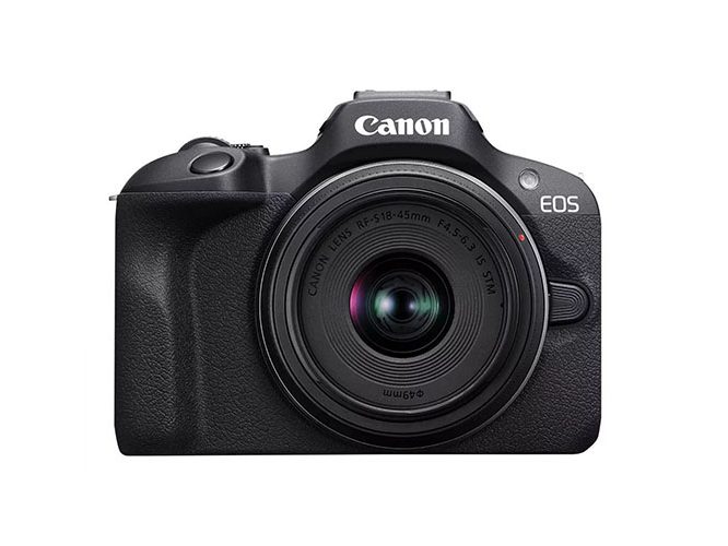 A Canon EOS R100 mirrorless camera on a white background.