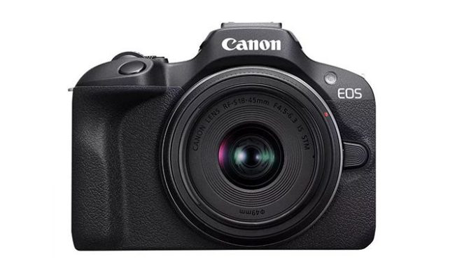 A Canon EOS R100 mirrorless camera on a white background.