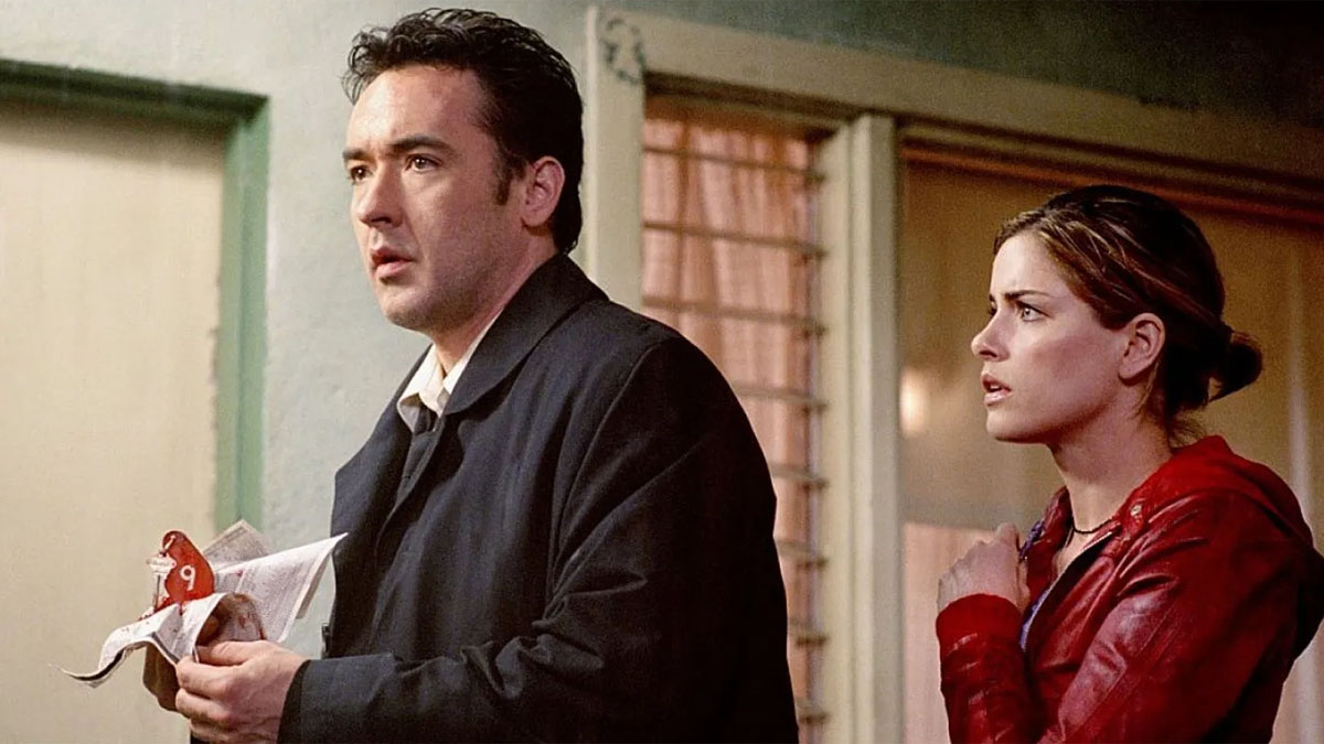 John Cusack e Amanda Peet em Identidade.