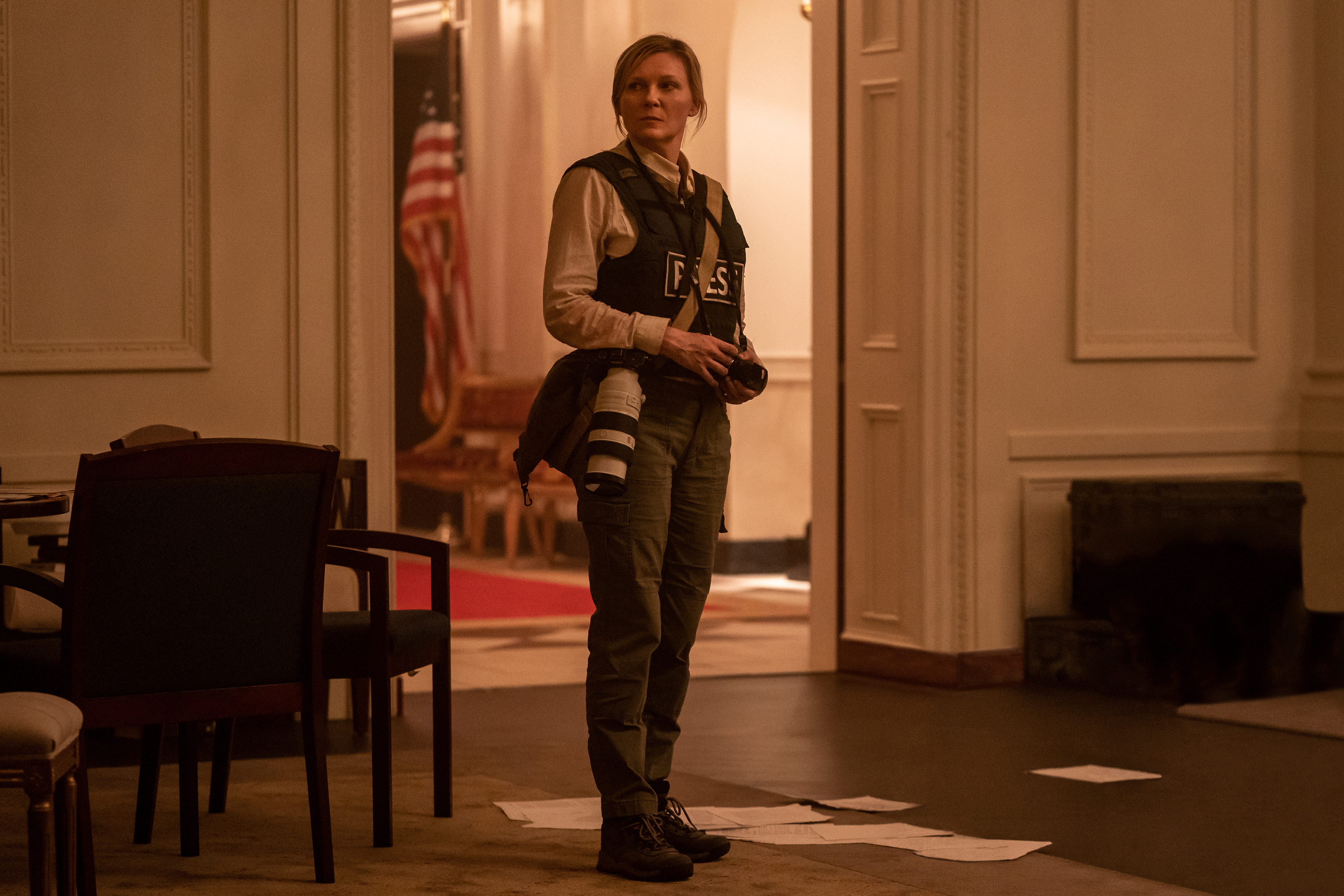 Kirsten Dunst wears a press vest in Civil War.