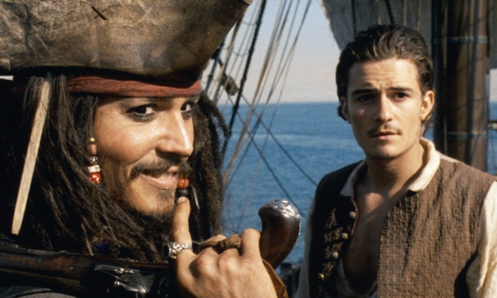 Johnny Depp as Jack Sparrow with Orlando Bloom's Will Turner in Pirates of the Caribbean: The Curse of the Black Pearl.