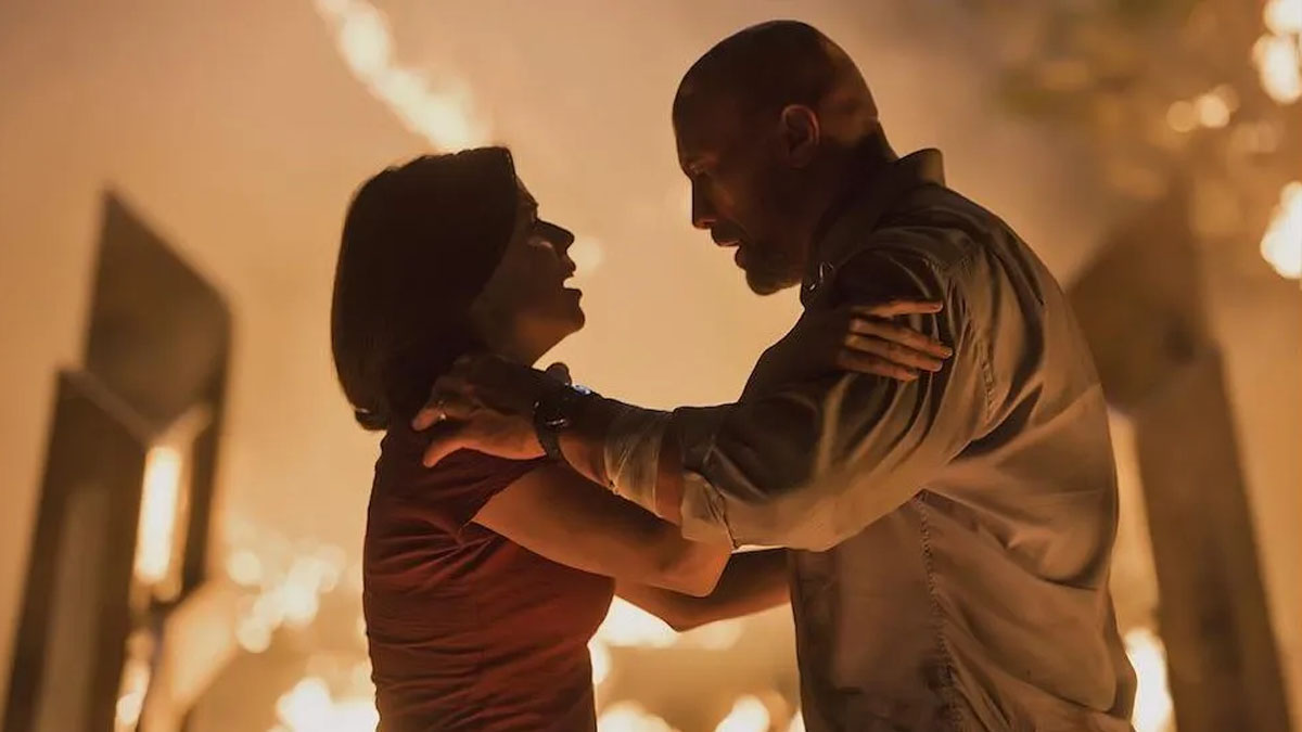 Neve Campbell and Dwayne Johnson in Skyscraper.