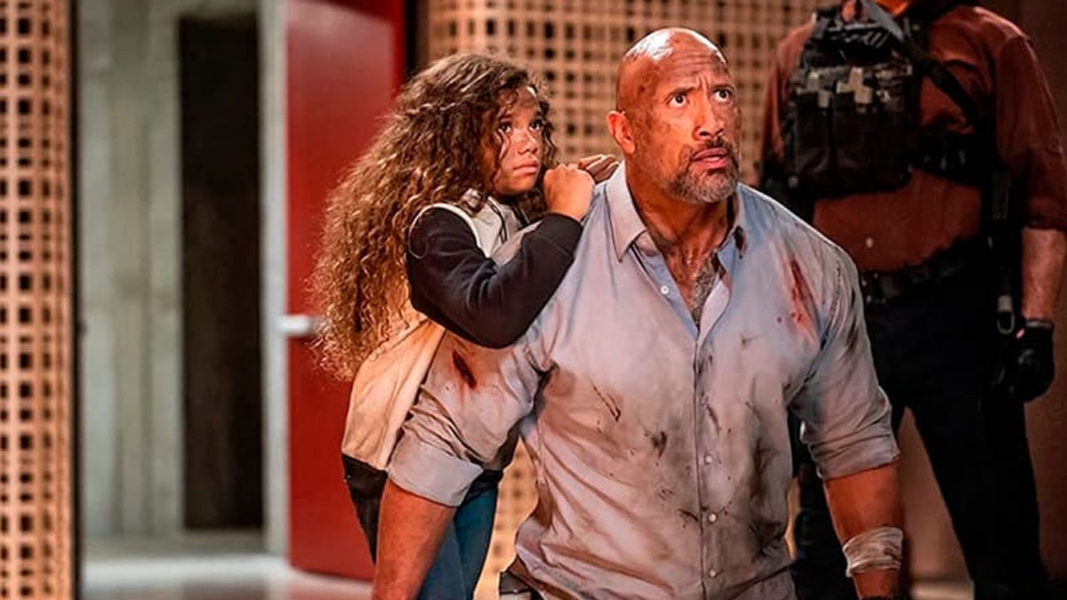 McKenna Roberts and Dwayne Johnson in ``Skyscraper.''