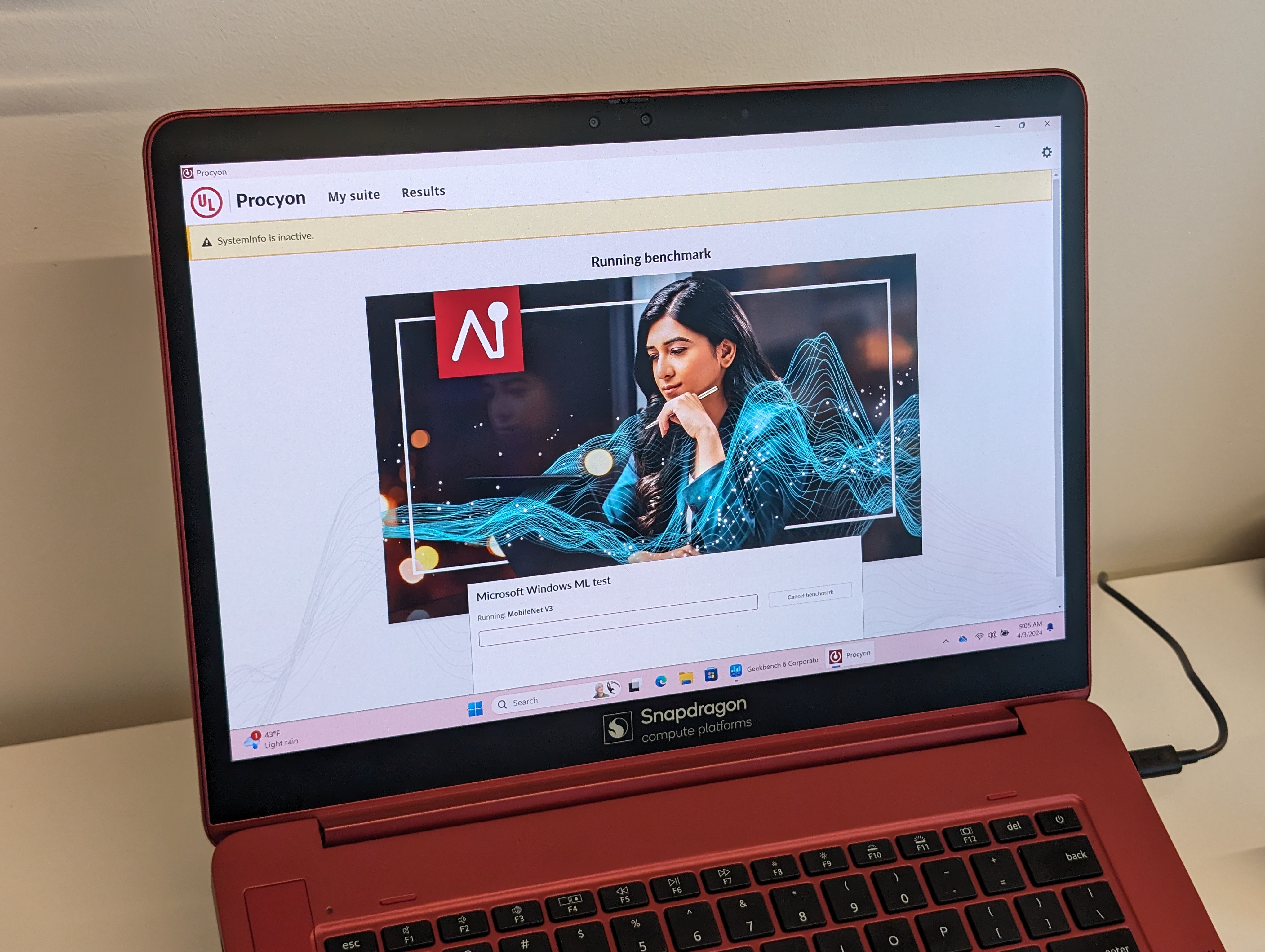 A photo of a laptop with the Snapdragon X Plus running an AI benchmark