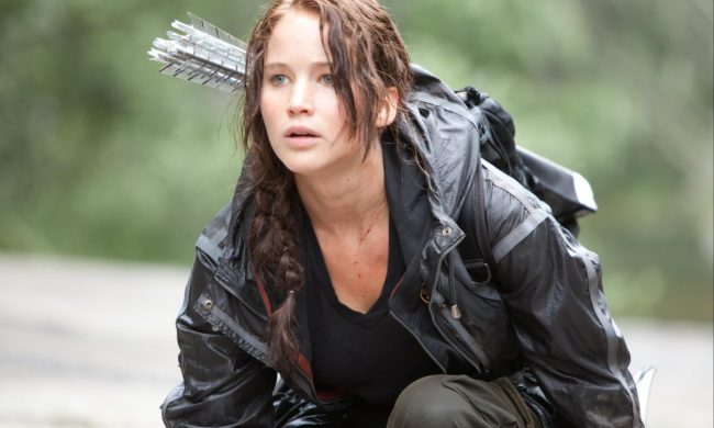 Jennifer Lawrence crouches to the ground.