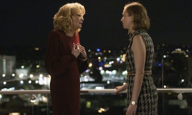 Deborah and Ava in Hacks standing on a balcony talking in a scene from season 3 of Hacks.
