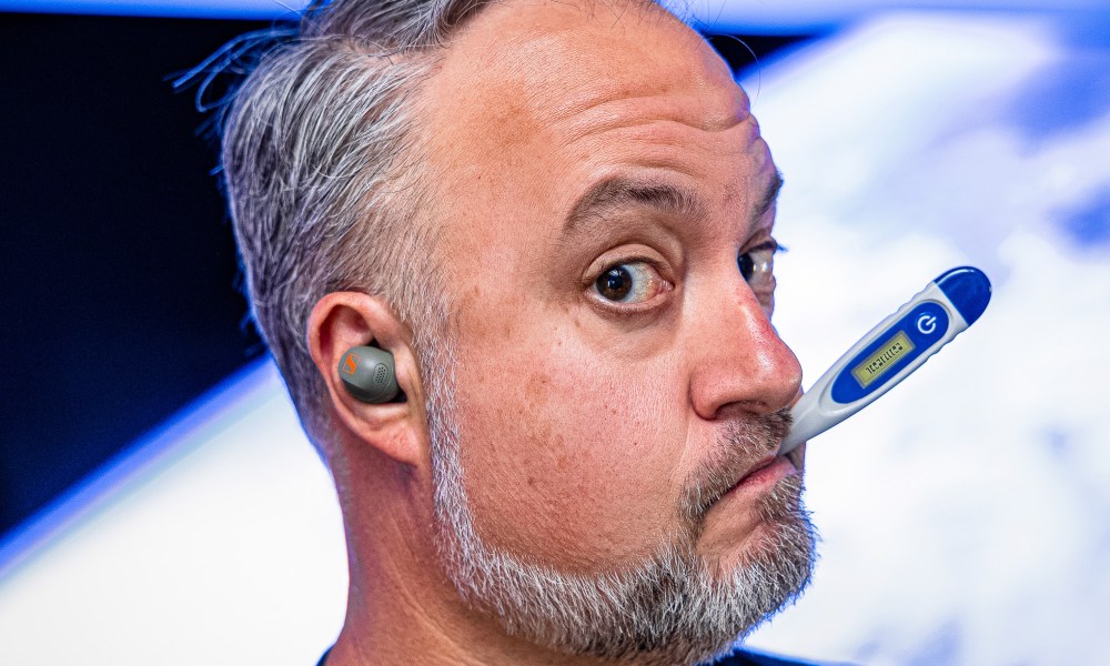 Phil Nickinson with the Sennheiser Momentum Sport, and a thermometer.