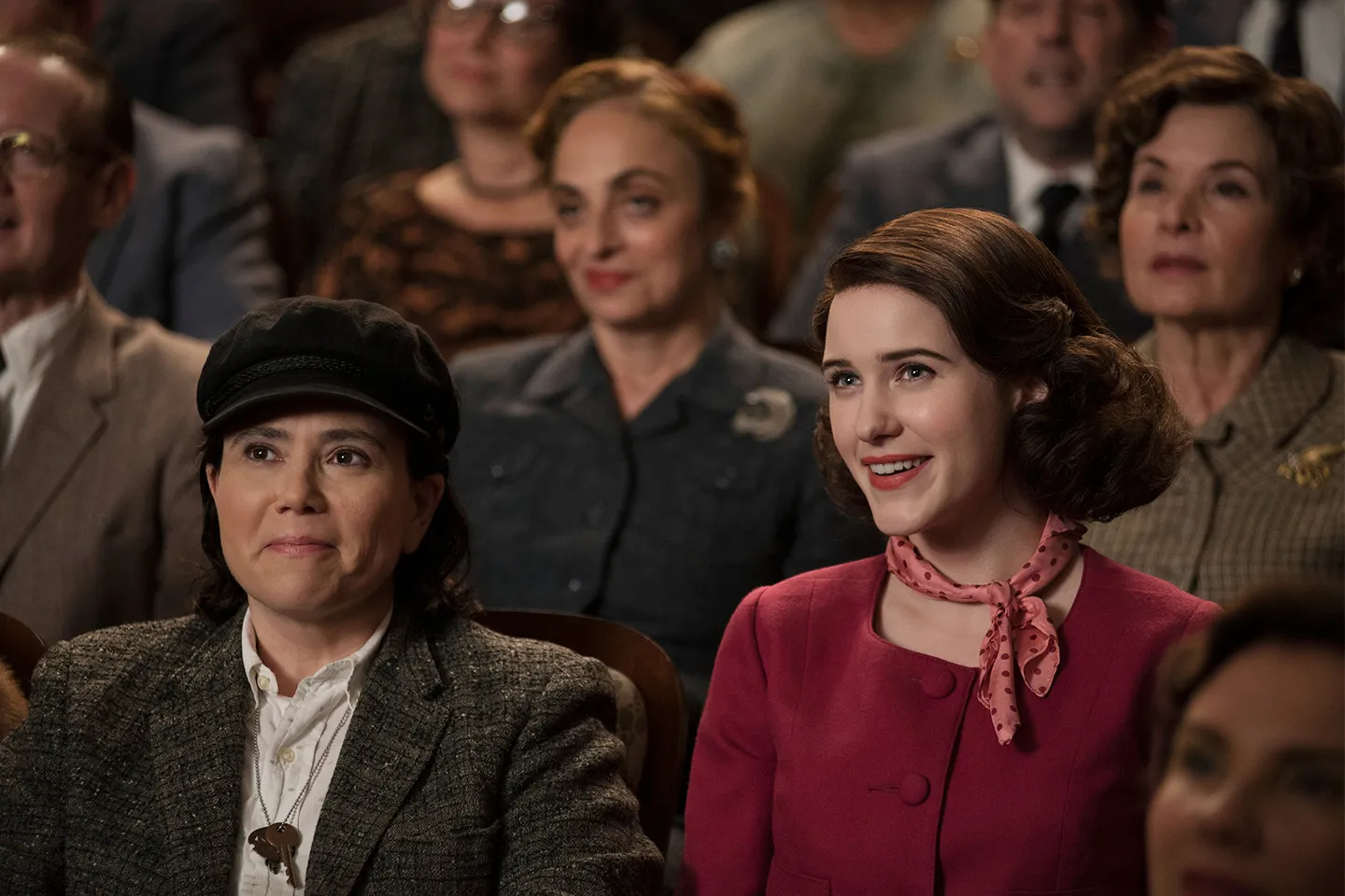 Alex Borstein and Rachel Brosnahan sit together in The Marvelous Mrs. Maisel.