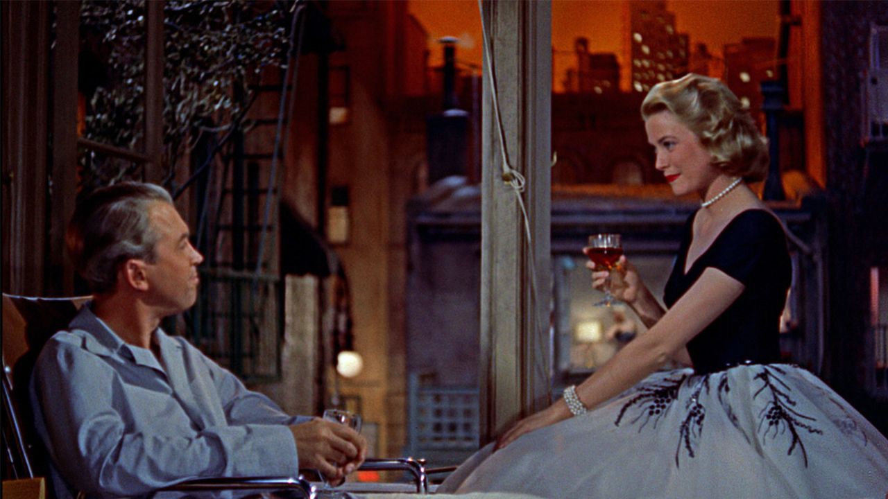 James Stewart and Grace Kelly as Jeff and Lisa talking in Rear Window.