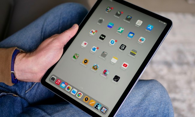 A person holding the Apple iPad Air (2024), showing the screen.