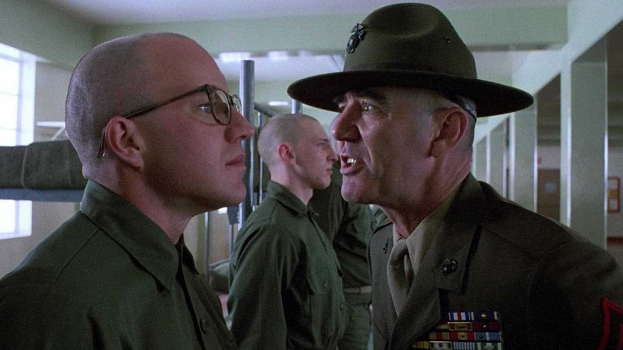 A sergeant yelling at a soldier wearing glasses in a scene from Full Metal Jacket.