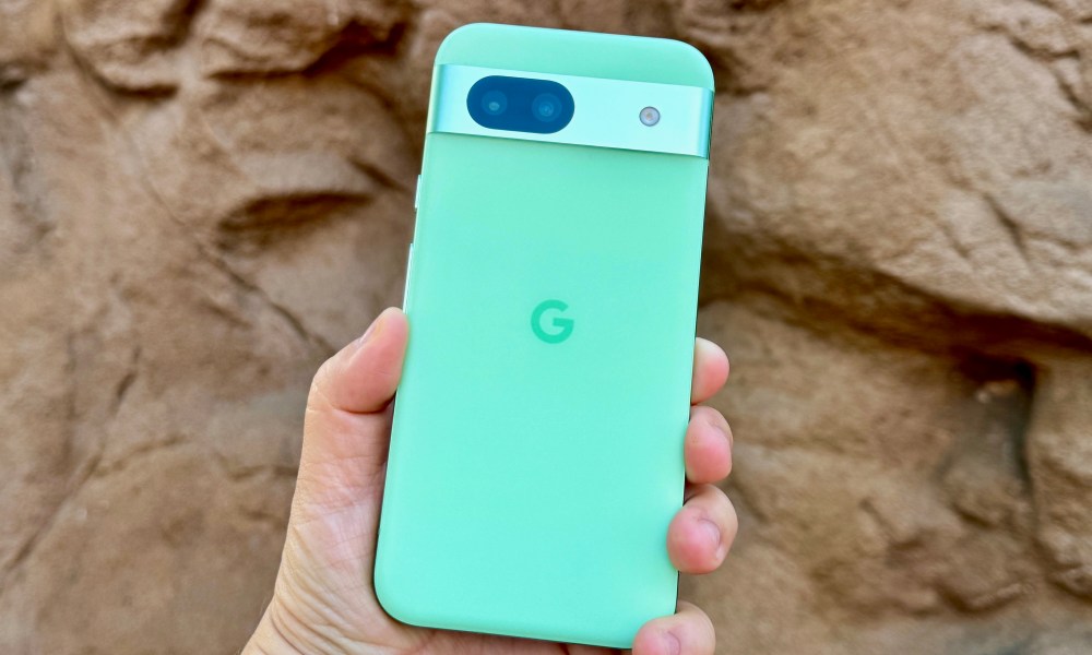 A person holding the Google Pixel 8a