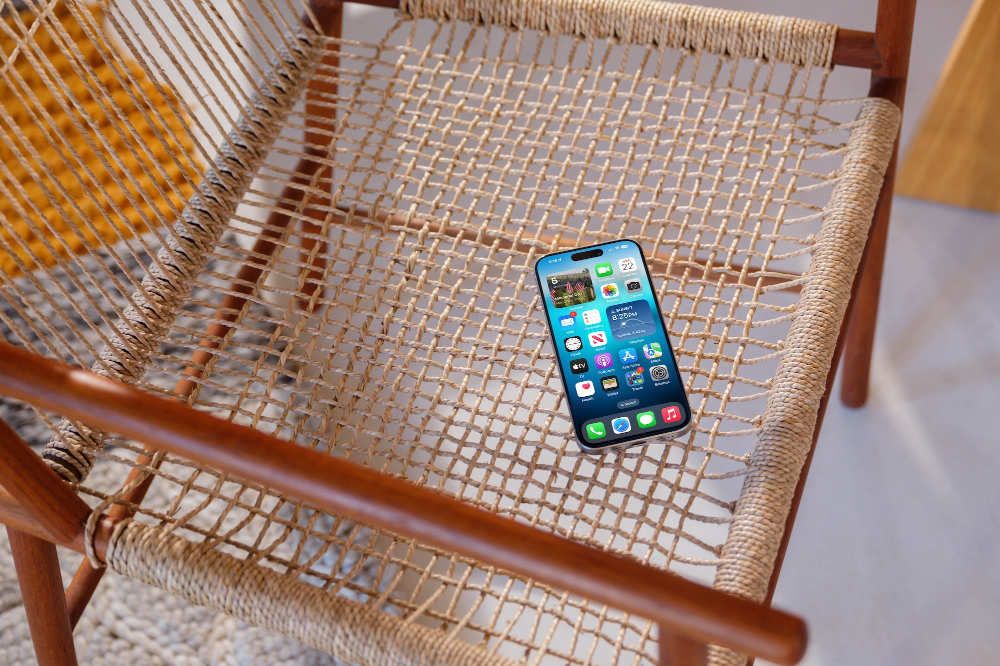 An iPhone sitting on a chair.