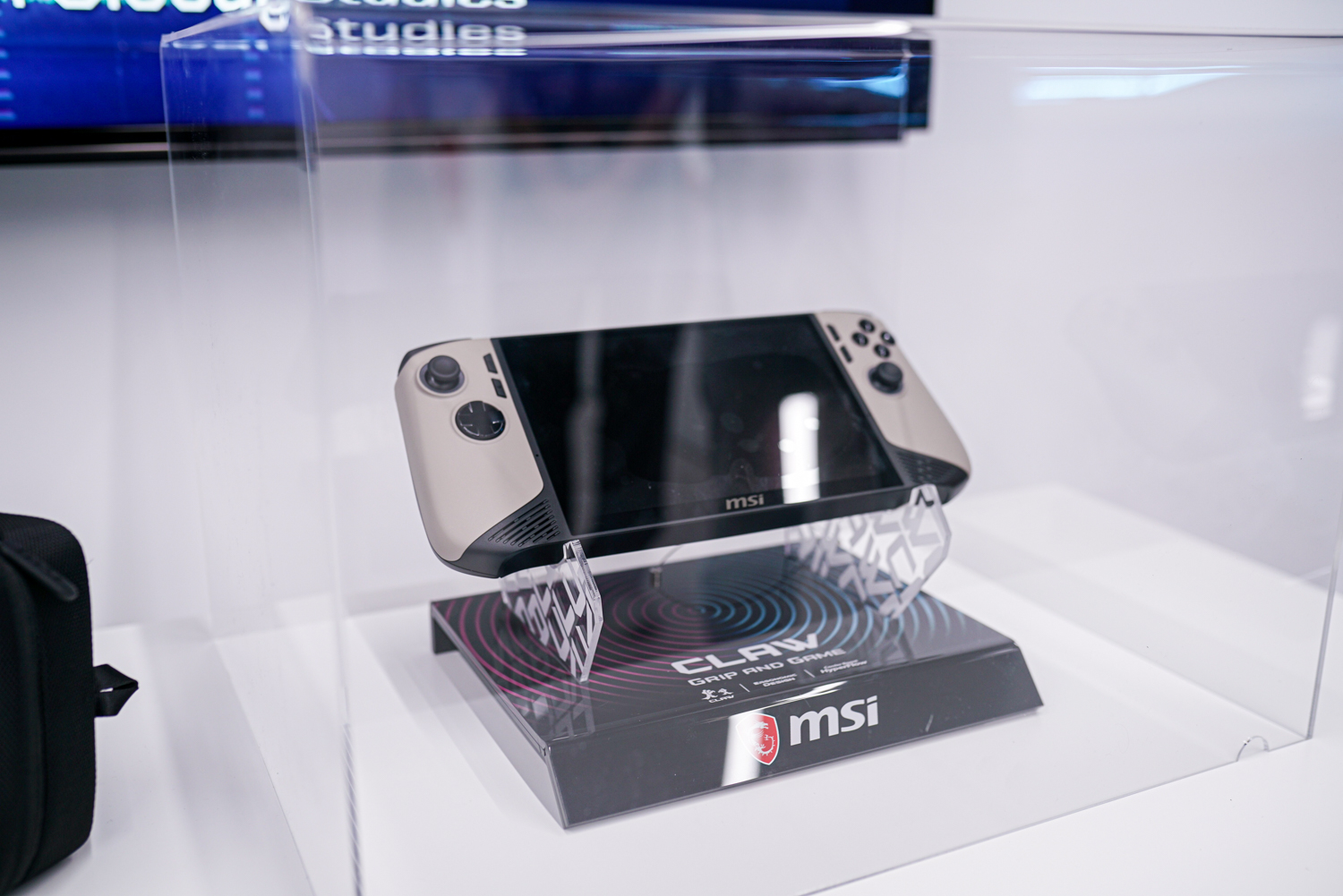 The MSI Claw sitting inside a display case.