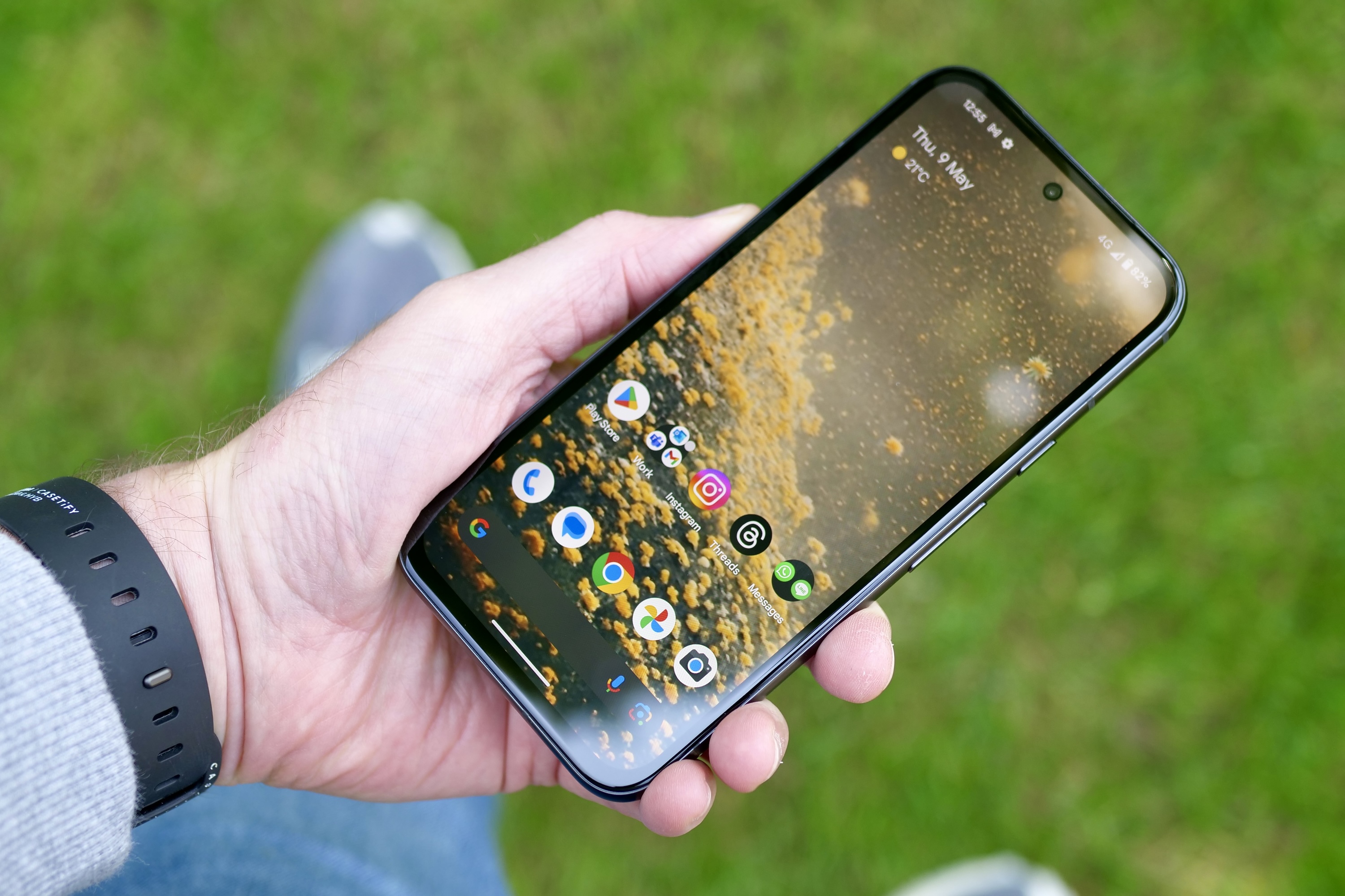 A person showing the Google Pixel 8a's screen.