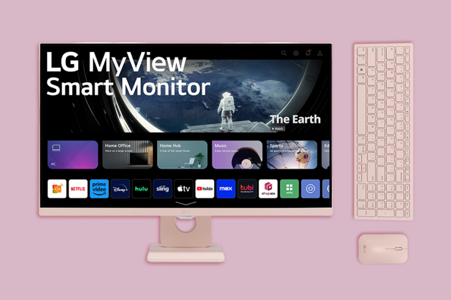 The LG smart monitor and peripherals on a pink background.